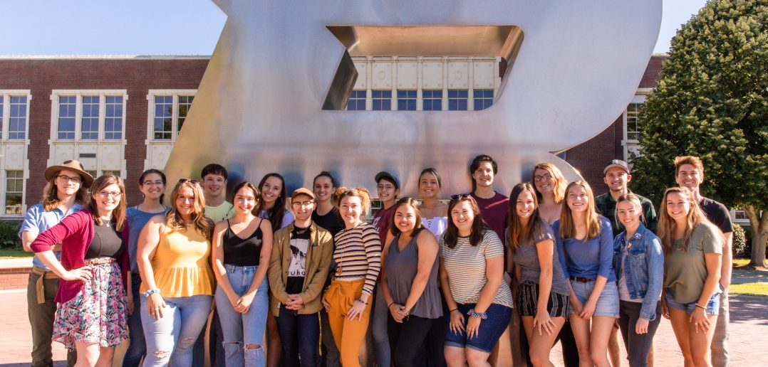 The Arbiter team standing in front of Boise State B statue.