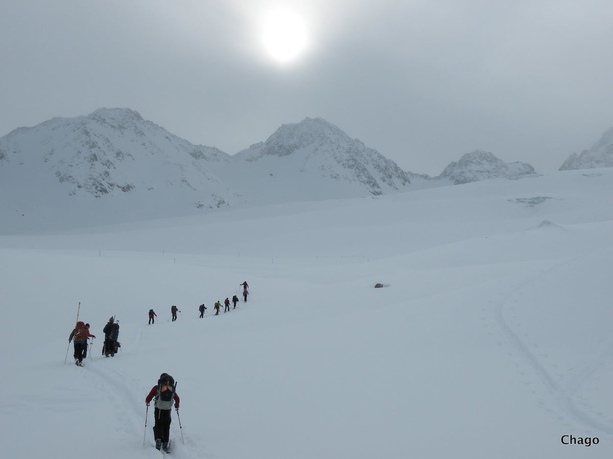 Researchers ski up snowy mountain