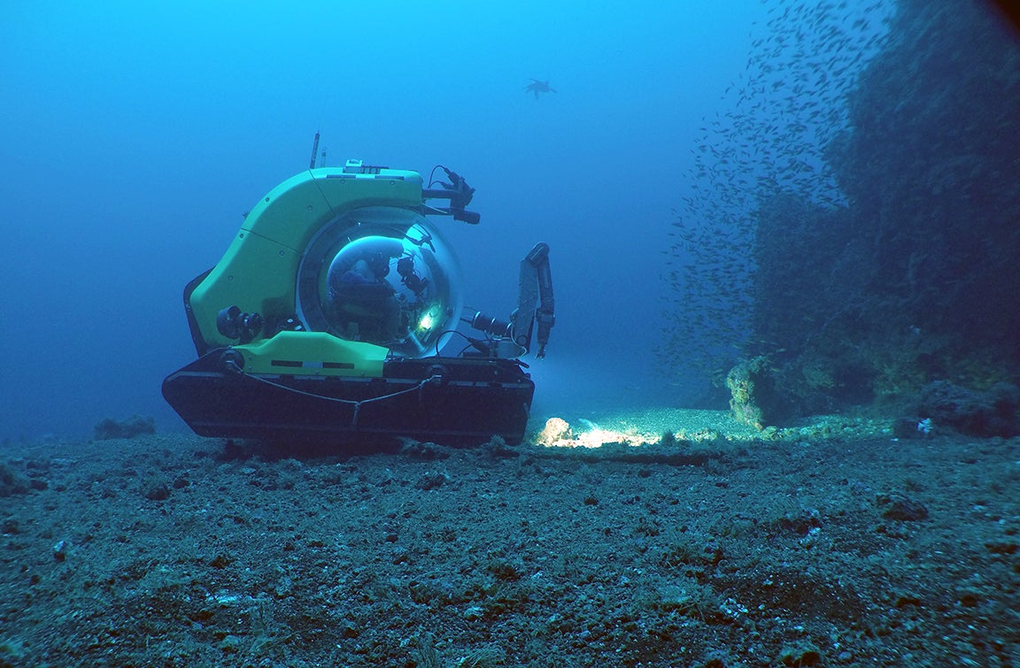 Investigating a large spire of lava at the top of a seamount off the coast of Santiago Island, Galapagos (photo credit Dan Fornari; WHOI MISO Facility)