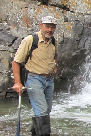 Vladymir Davydov portrait in front of a waterfall