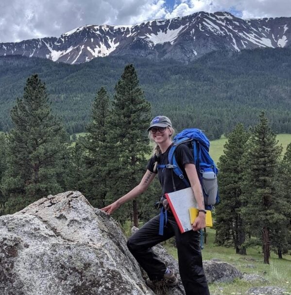 Alexis Thomas hiking in mountains