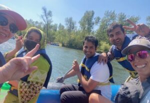 people on a raft take a selfie together