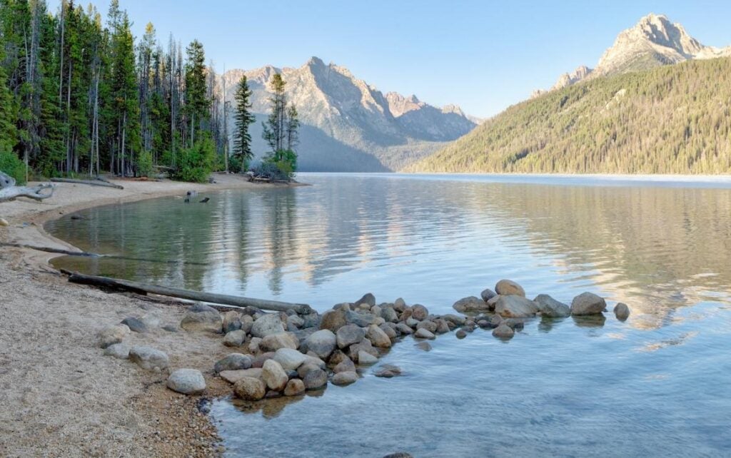 Idaho mountain lake with small beach.