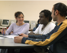 three students sitting in classroom