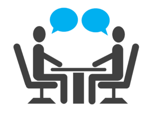 Picture of two stick figures sitting at a table across from one another with cartoon style blue callouts