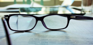 Image of glasses on sheets of paper
