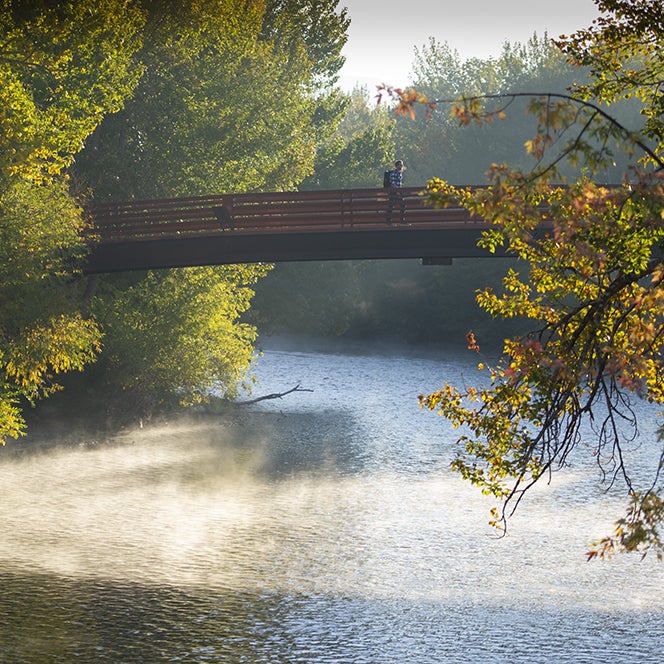 The boise river in summer with steam rising off the water. 
