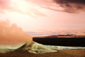 a fumarole vent in the Earth's surface emitting steam and gases