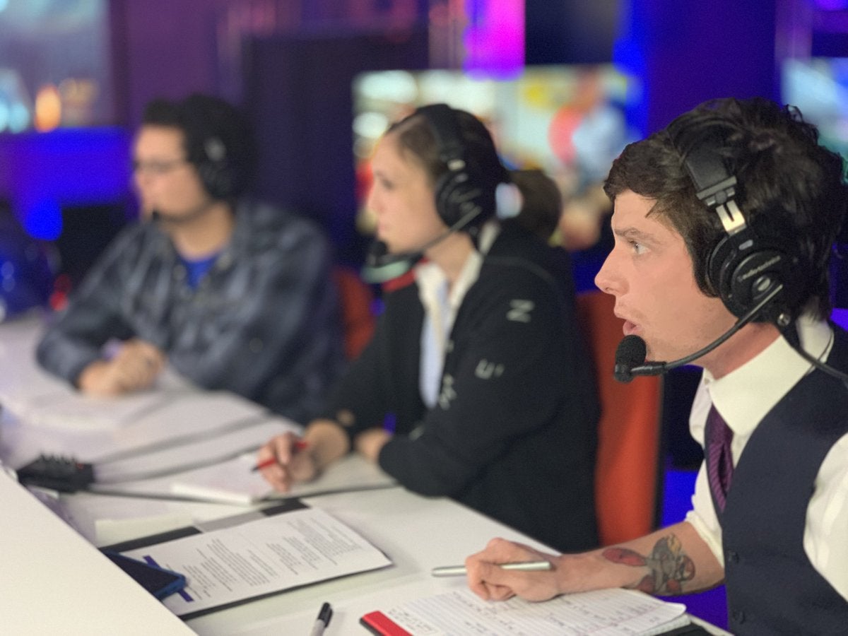 Three broadcasters sitting together.