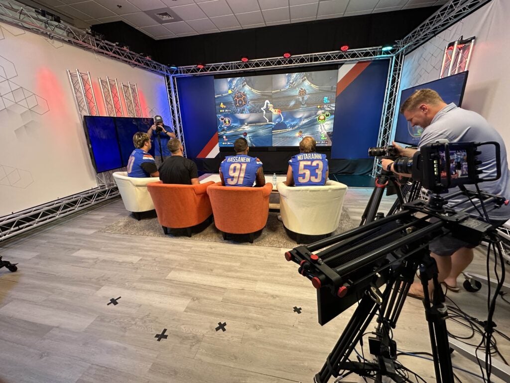 Photo of Boise State football players playing video games.