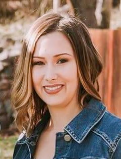 Julie Davis smiles at the camera in a headshot. 
