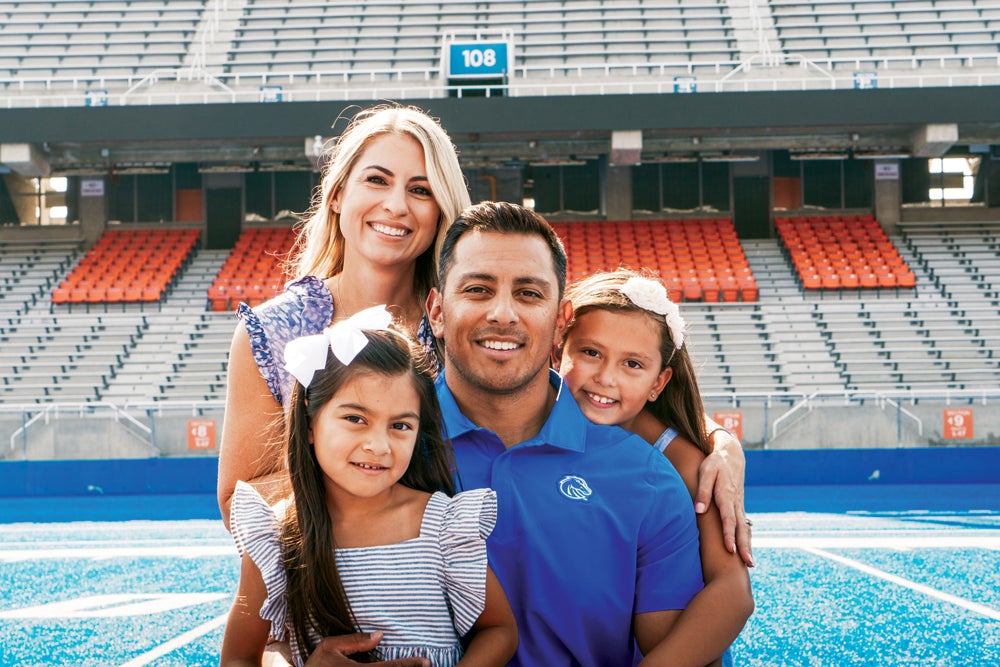 Andy Avalos and Family on the blue turf
