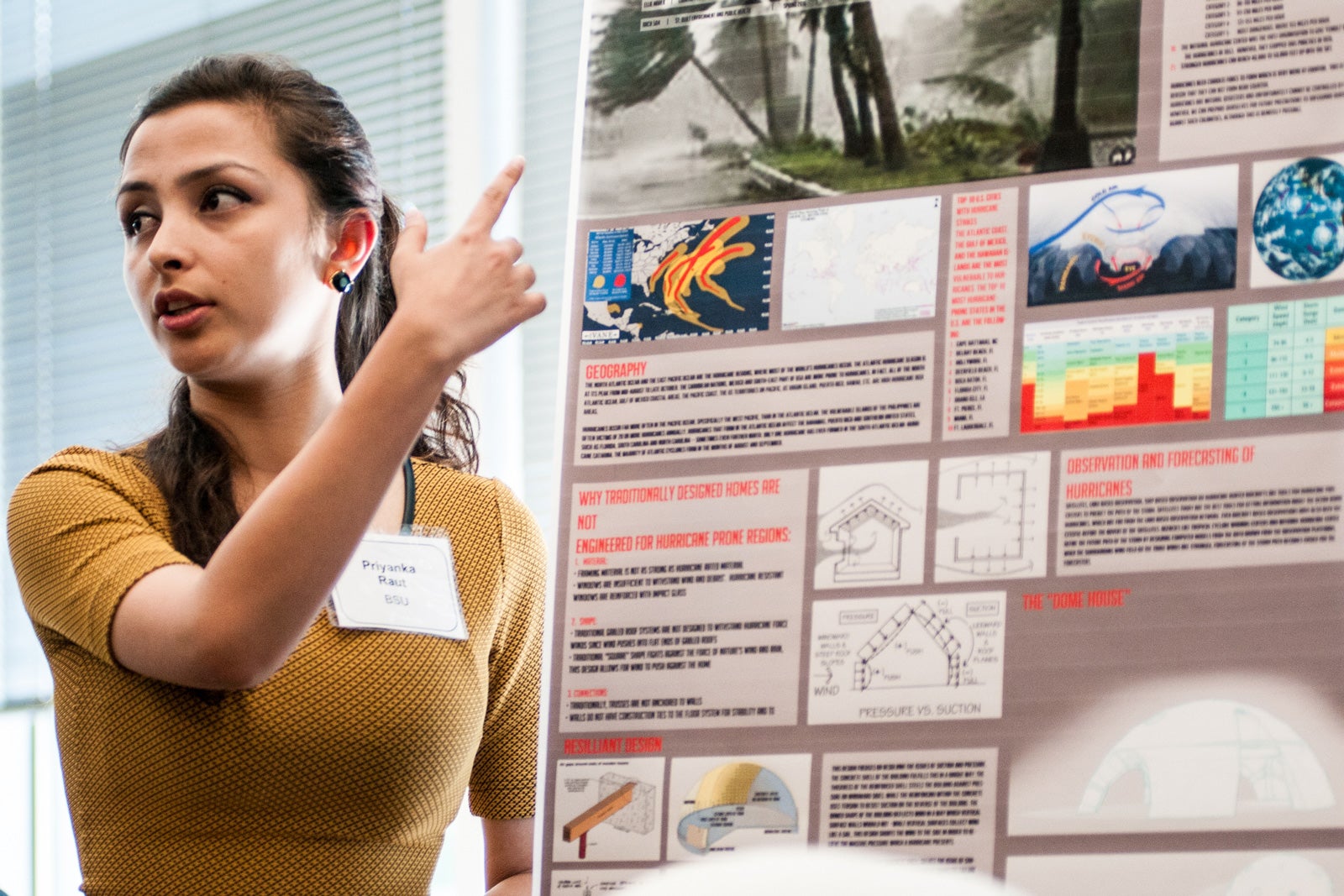 Student presenting research poster