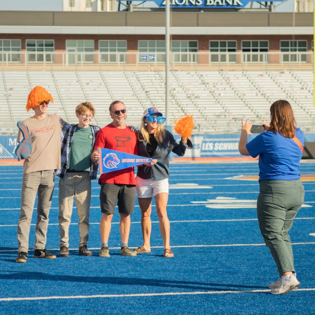 A family poses for a photo on The Blue