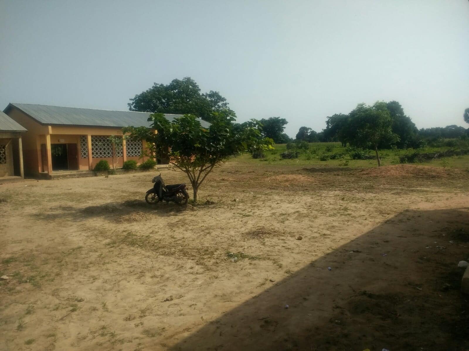 landscape with building and motorbike in foreground
