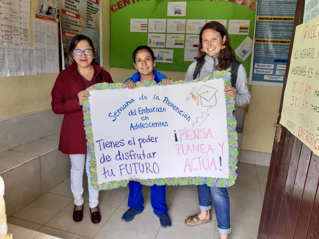 Emma working as a Water, Sanitation, and Hygiene (WASH) volunteer. 