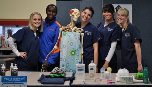 RadSciHealthFair2 Radiologic Sciences students at handwashing table