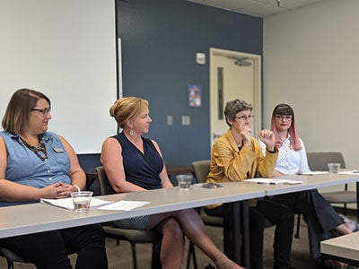 panelists speaking on panel