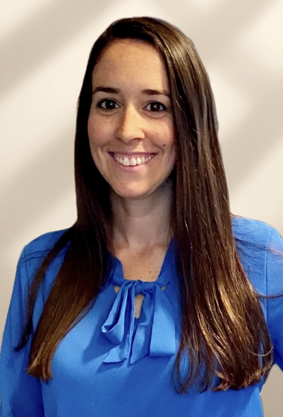 A headshot of RN-BS alum Crystal Crafton in a blue shirt smiling.