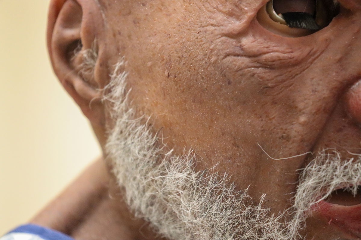 Close up of a manikin's skin and beard.