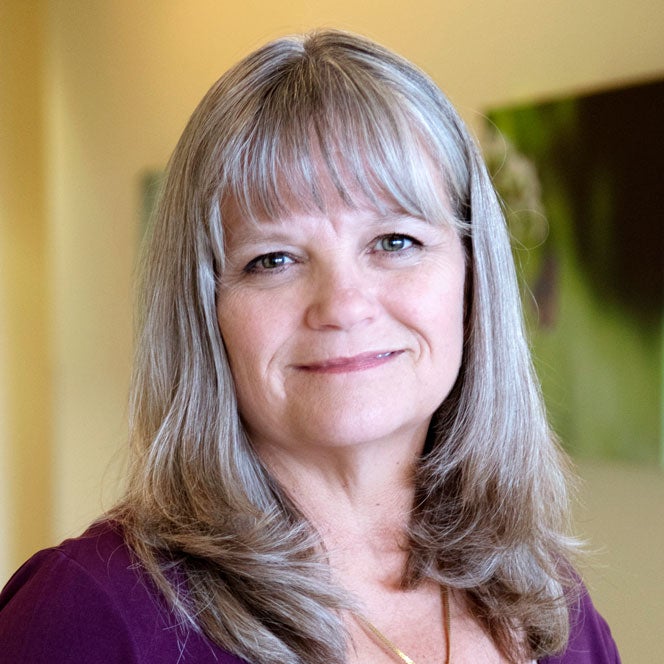 Headshot of Maura Rasmussen smiling