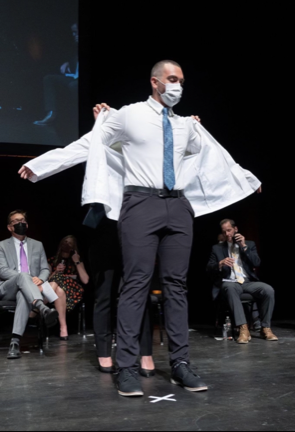 Nathan Epstein receives his white coat