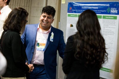 Christopher Oribaza presenting research