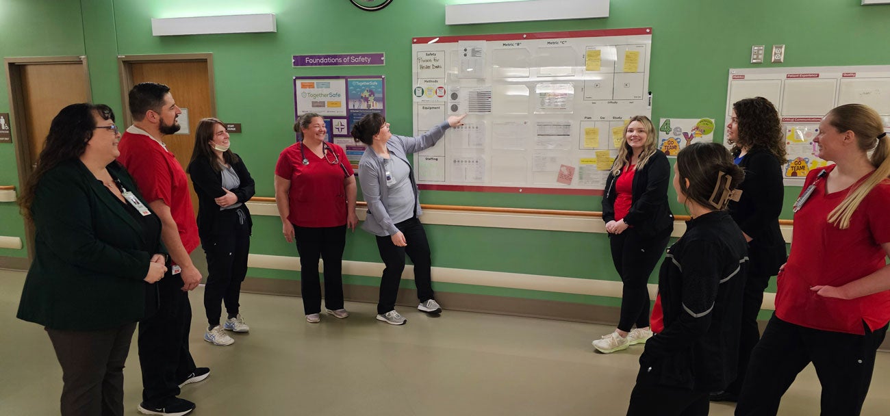 Misti Leavitt in a standing meeting with Saint Alphonsus staff