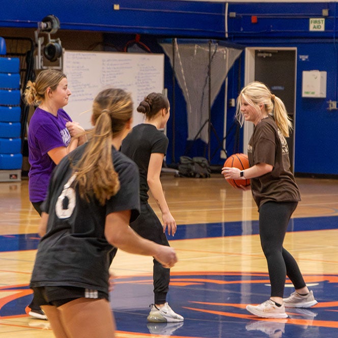 K-12 PE students play basketball during their Instructional Basketball class