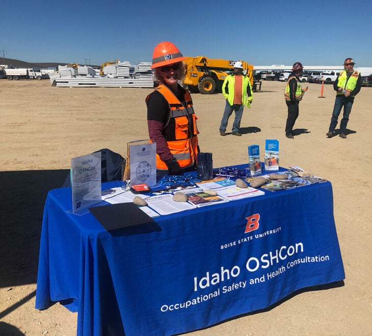 Kimberli Reynolds educates workers about workplace safety at a construction site