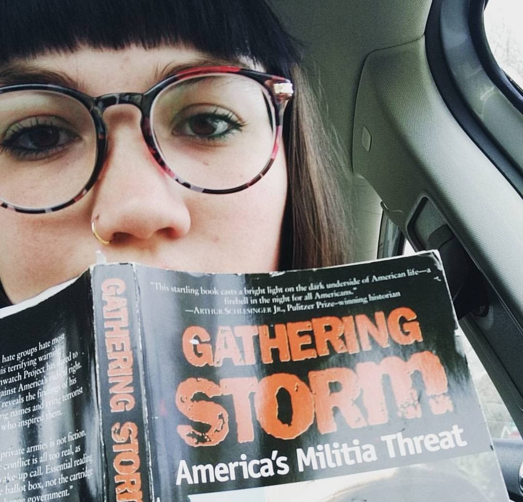 Alisha Graefe poses with Morris Dees’ Gathering Storm, the book that largely inspired the subject of her thesis