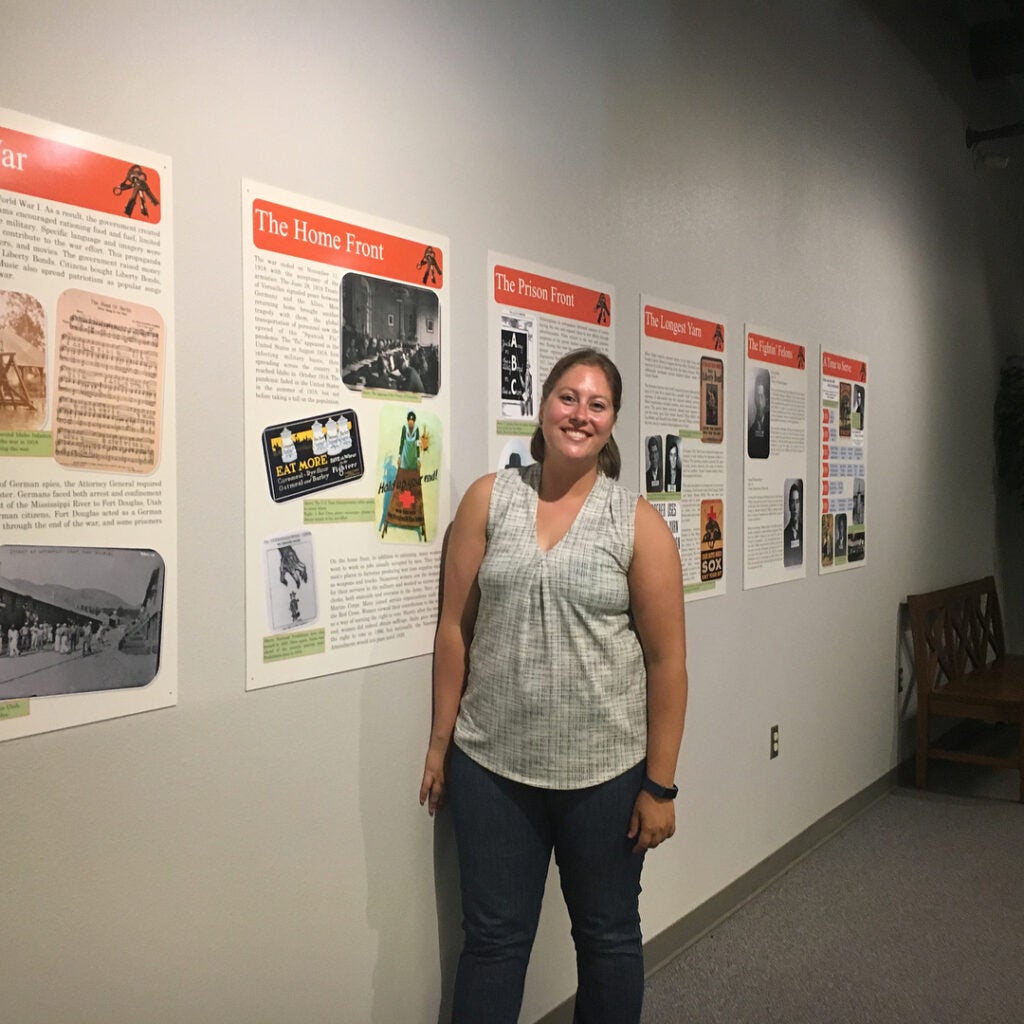 Hayley Noble and her exhibit, currently on display at the Old Idaho Penitentiary.