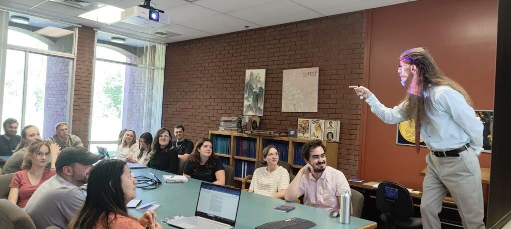 Dr. Krohn lecturing in a classroom of students