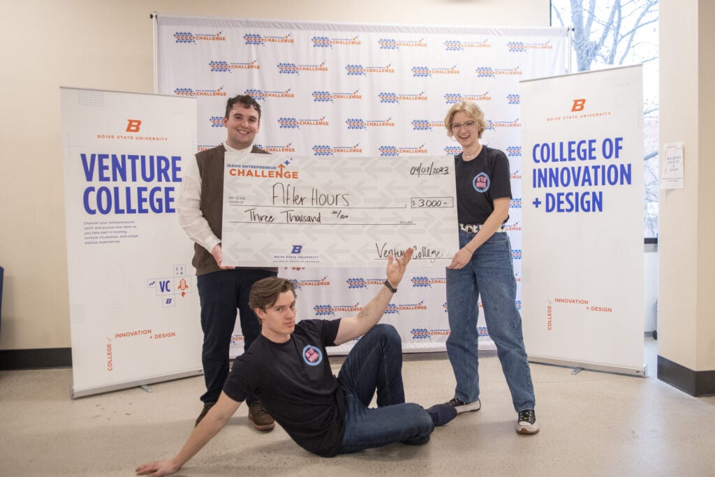 Joseph Raymant, Mimi Brimhall, and Samuel Jones posing with their prize award