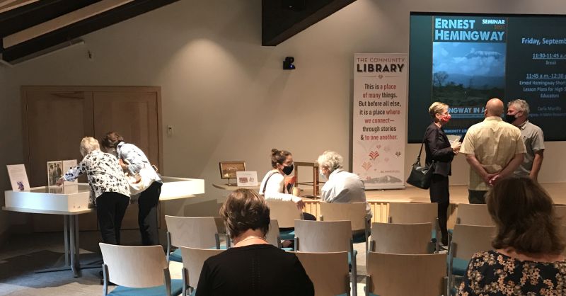 Dr. Tromp and attendees looking at the Clara Spiegel papers at the Hemingway Seminar