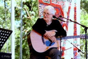 photo of Rosalie Sorrels holding a guitar