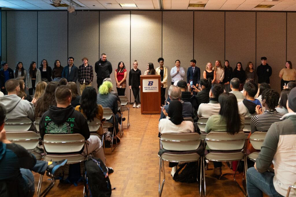 Group of students in front of audience members at the Conference on Language, Identity, and Culture