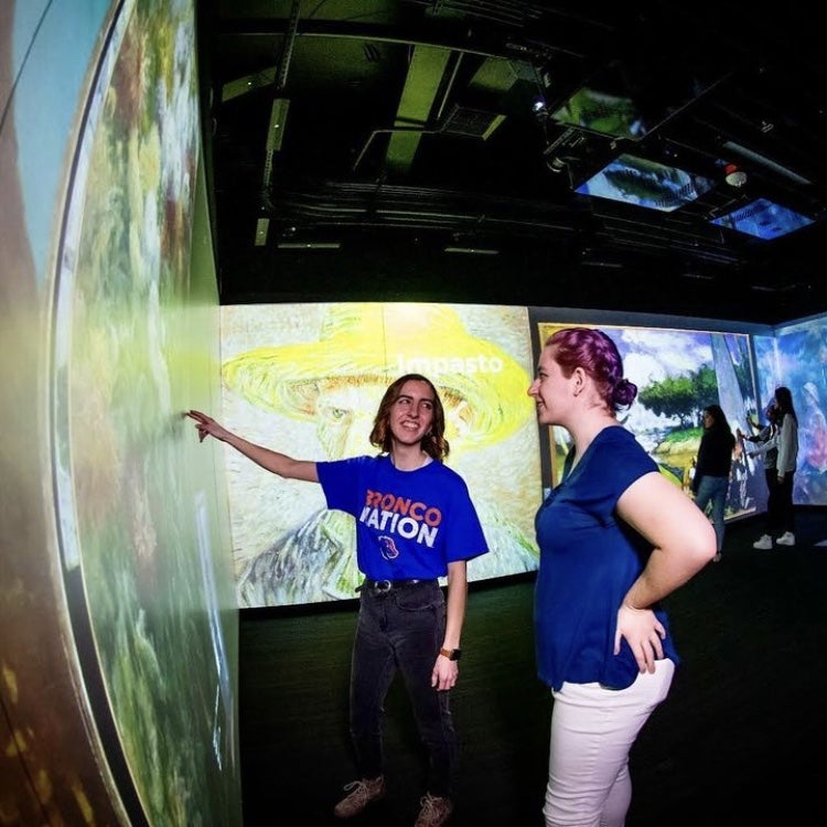 student helping with a tour