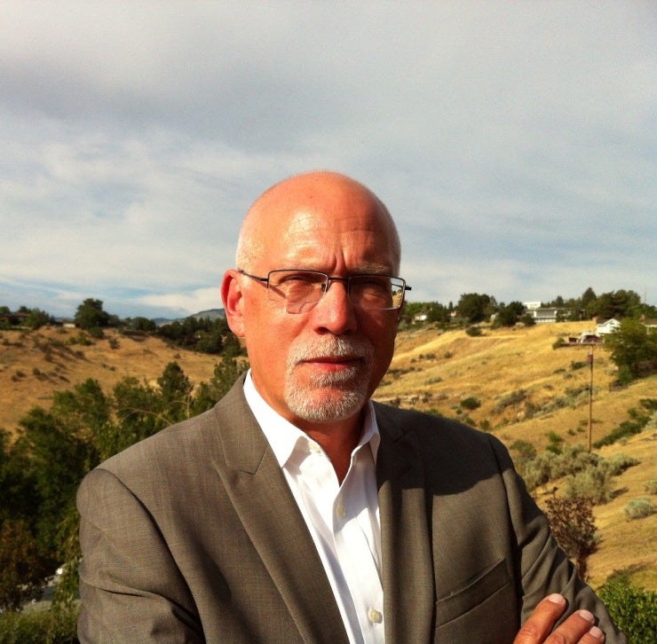 Photo of Eric Lindquist standing outside.