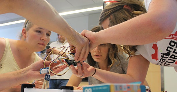 Teachers building weather stations