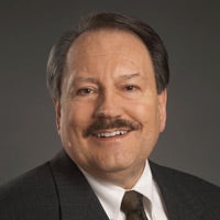 Portrait of Greg Raymond.