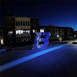 B sculpture at night
