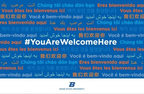 Poster that reads #YouAreWelcomeHere in multiple languages.