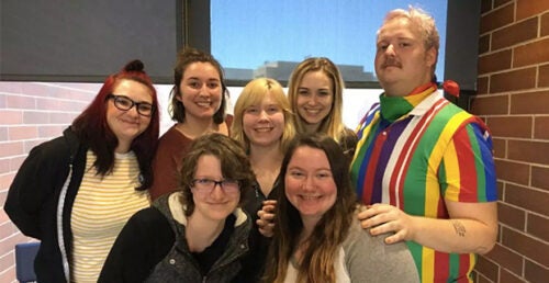 A group of posing literature students