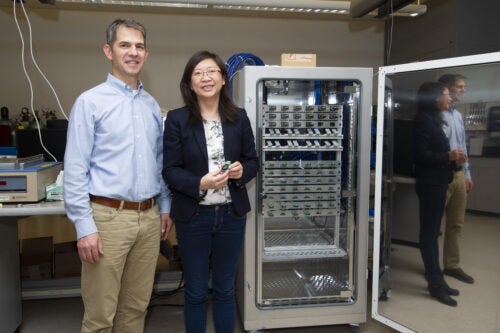 Xiong and Graugnard pose in the lab