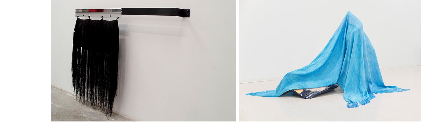 (left) black hanging textile representing a mudflap (right) a blue beaded tarp draped over auto body parts
