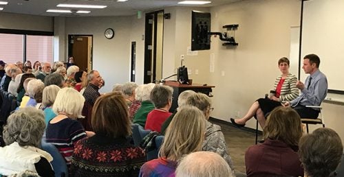 Two people give a talk