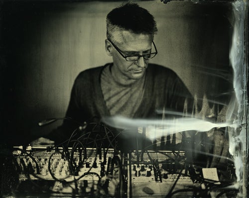 tintype photograph of Ted Apel at music board