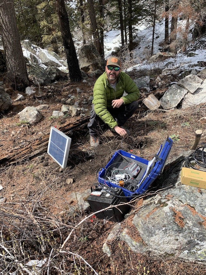 Technician installing a siesmometer.
