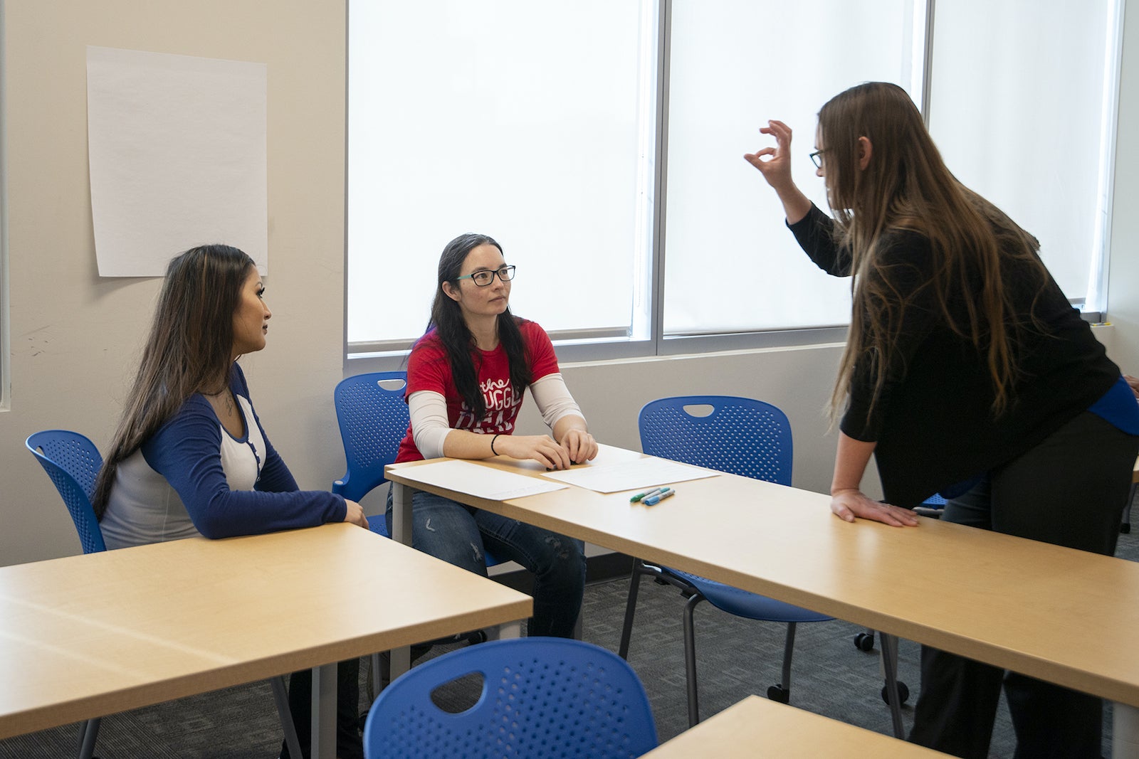 Cathie Olschanowsky instructs two students.